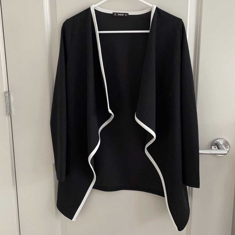 Black and white outlined open “jacket”